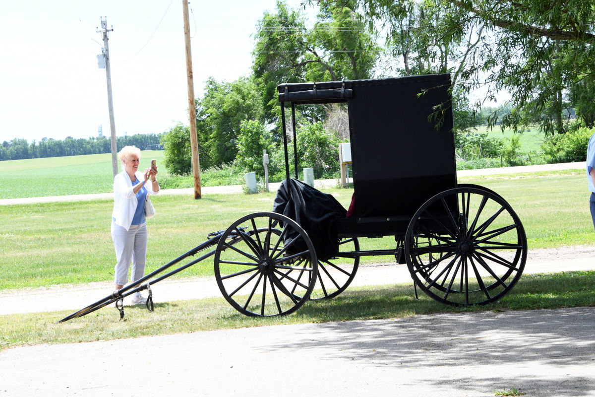 184 Rosalie Hillmer snaps a photo of the Amish buggy outside the Green Gables restaurant.JPG